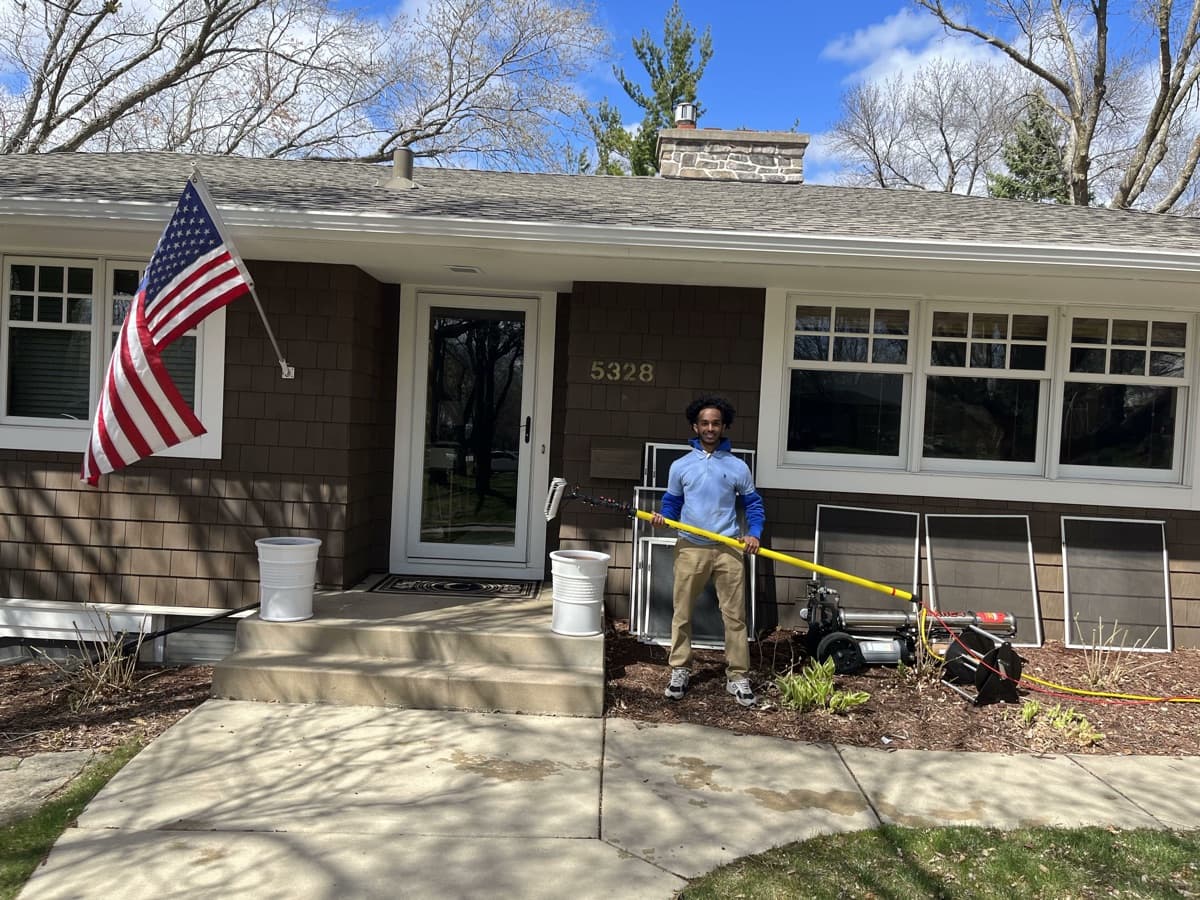 MN Window Cleaning technician on the job